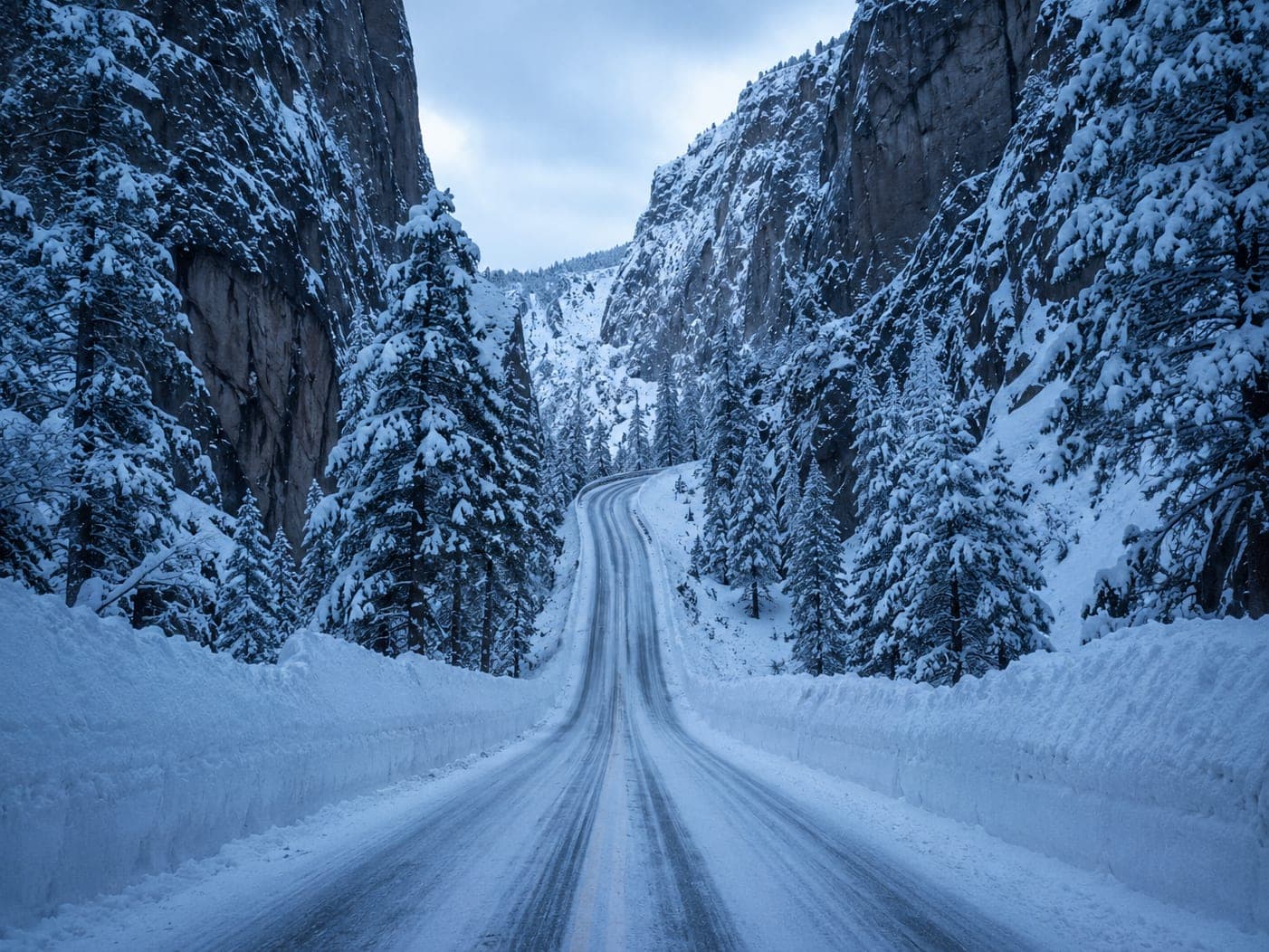 Plowed canyon road in deep winter snow